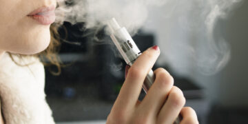 Woman Smoking an E-Cigarette image