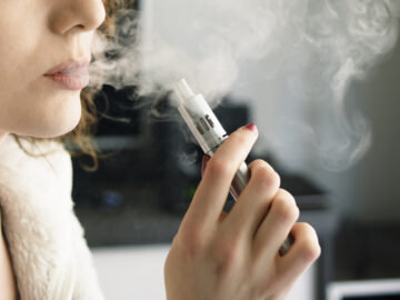 Woman Smoking an E-Cigarette image